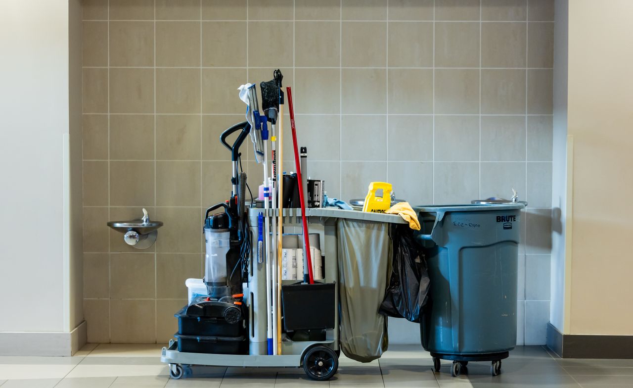 about-01 A comprehensive collection of professional cleaning tools on a cart in an indoor environment.